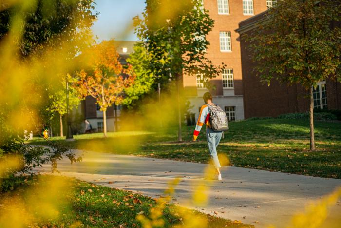 student walking in the fall